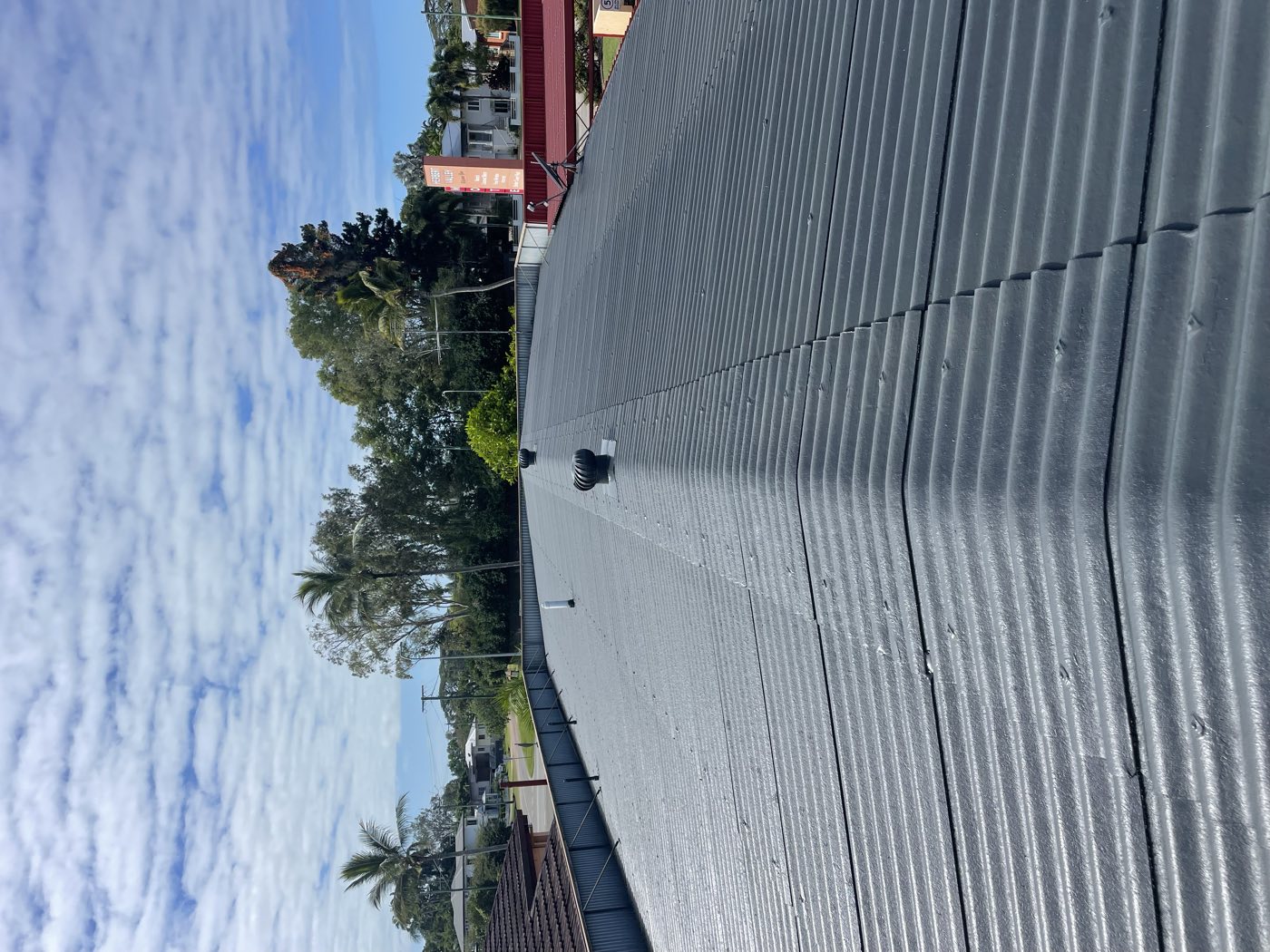 Soiled tile roof restored with fresh coating