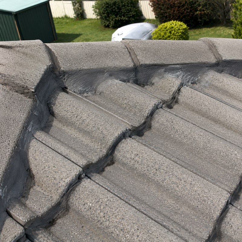 Re-bedding and re-pointing ridge caps