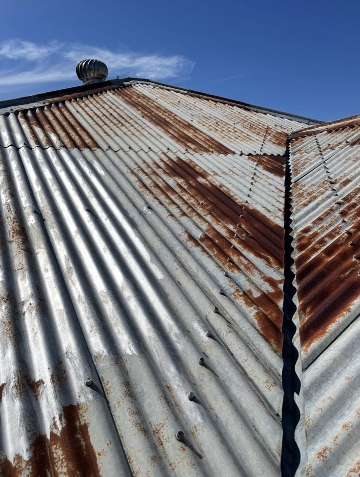 Rusted iron roof before respray