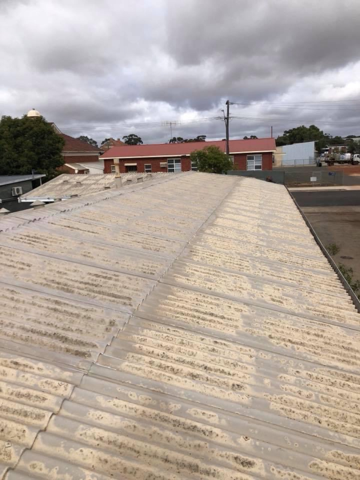 Tired white roof before recoating