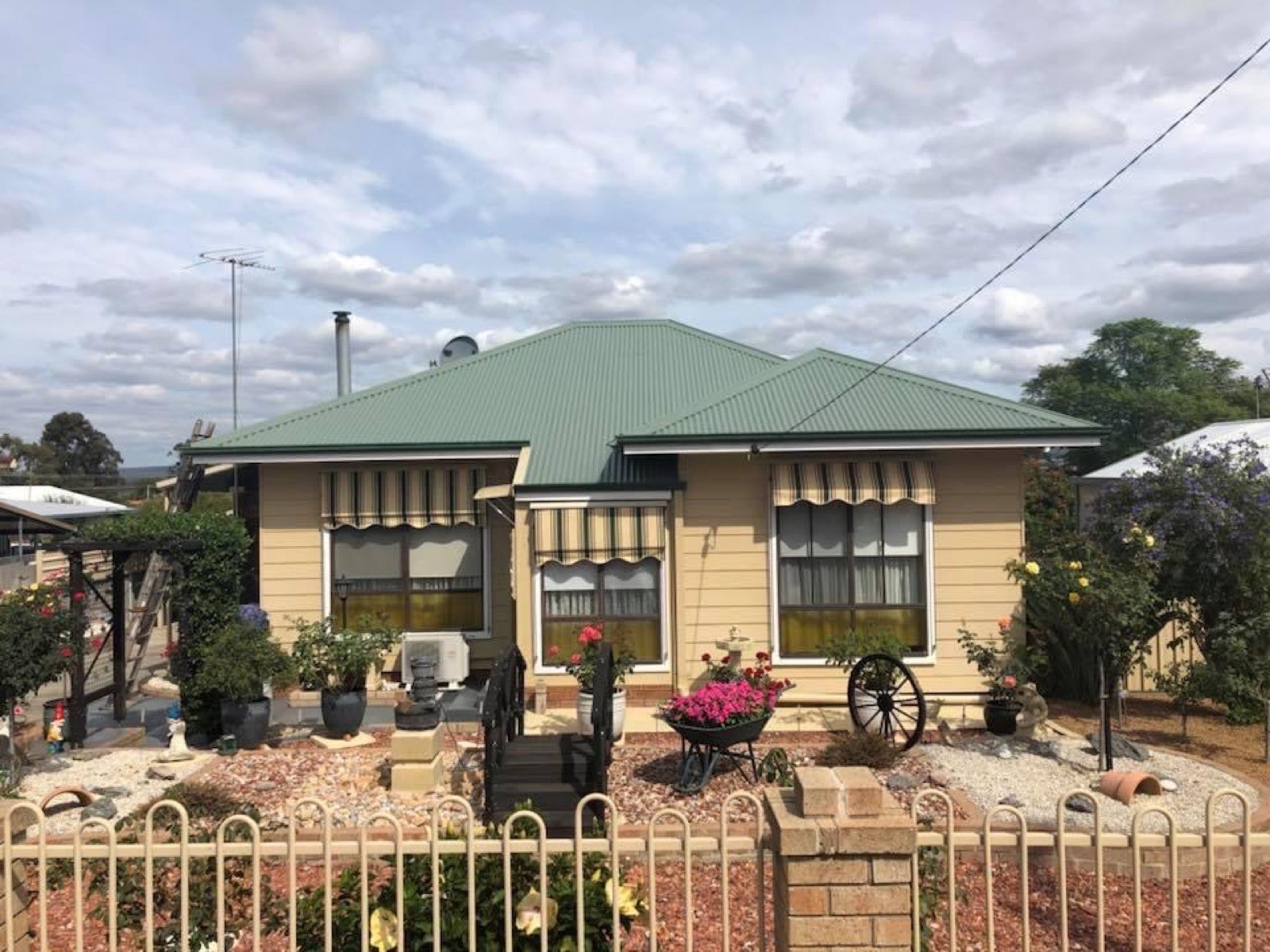 Yellow home with restored roof